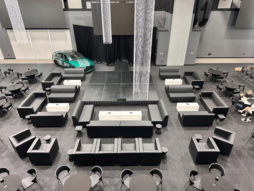 Black leather VIP furniture rental setup for a luxury corporate event in Tampa, Florida